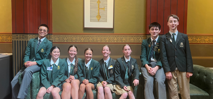 Students sitting on a couch at Parliament House